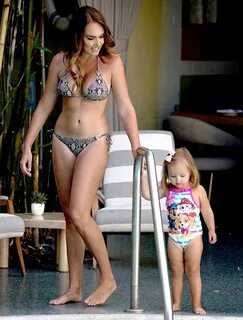 Tamara Ecclestone shows off her ample curves with daughter S