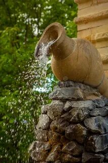 Fountain in the Form of Water Pouring from a Jug Stock Image