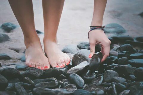 Feet Hand on stones on Beach free image download