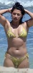 Vanessa White in skimpy yellow snakeskin bikini in Ibiza