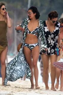 Nina Dobrev displays her toned tummy and pert derriere Beach