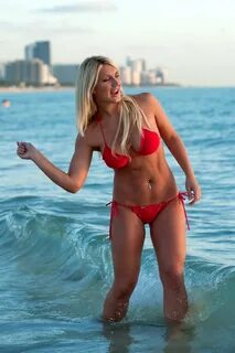Brooke Hogan showing off in a sexy red bikini on the beach i