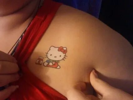Color Hello Kitty Tattoo On Front Shoulder