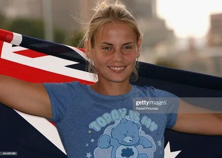 Jelena Dokic of Australia poses with the Australian flag on 