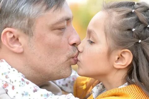 Portrait of Father and Daughter in Park Stock Photo - Image 
