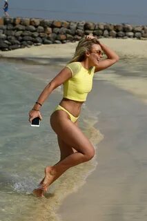 tallia storm stuns in a yellow bikini while at the beach in 