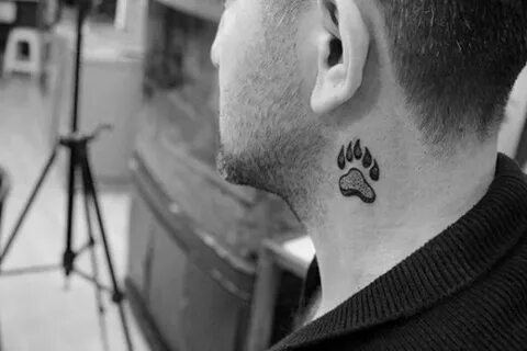 small symbolic tattoos, paw print with claws, tattooed in bl