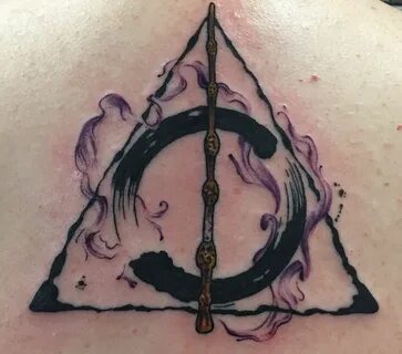 Harry Potter Deathly Hallows tattoo with watercolor done by 