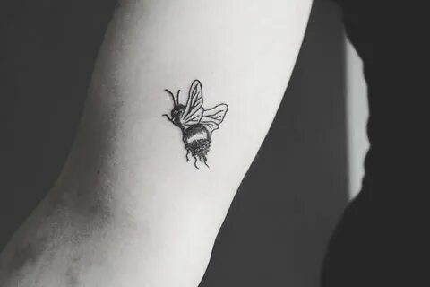 Cute little bee tattoo inked on the right arm Bee tattoo, Be