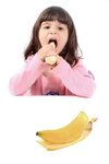 Little girl eating banana stock image. Image of eating - 212