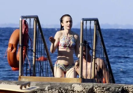 lily collins in a bikini spotted with a mystery guy at a bea