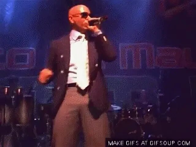 Pitbull cannot resist grabbing his own ample package.