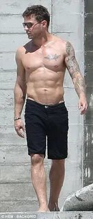 Shirtless Ryan Phillippe shows off his six-pack and tattoos 