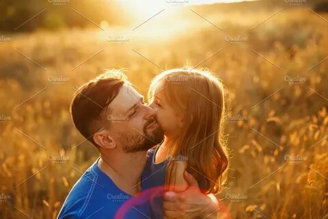 Father and daughter. Leisure. Kiss People Images Creative Ma