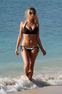 April Summers busty wearing skimpy black bikini at the beach