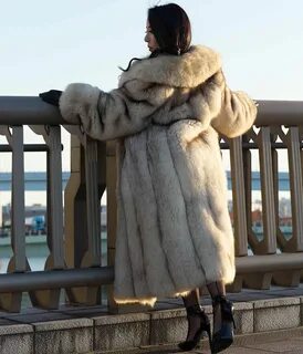 Image may contain: 1 person Fox fur, Fox fur coat, Fur coat
