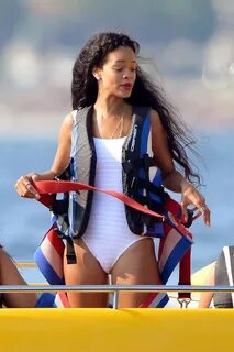 RIHANNA in White Swimsuit Posing on the Boat in Cannes - Haw