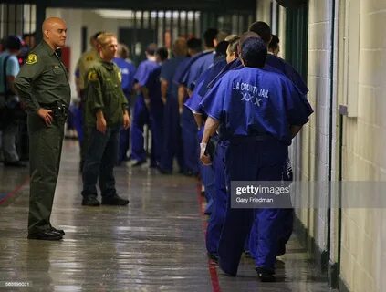 Prison inmates are watched by members of the Los Angeles Cou