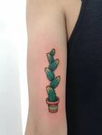 Traditional colored tall cactus tattoo inked on the right ar