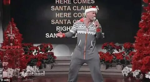 Dwayne 'The Rock' Johnson slips into a Christmas onesie to s