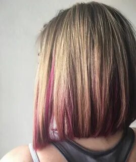 Blonde bob hairstyle with pink peekaboo highlights. Pink blo