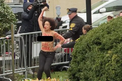 Topless protester arrested outside Cosby trial is former act
