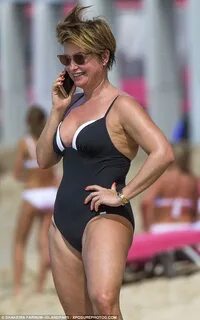Emma Forbes wears black and white swimsuit as she celebrates
