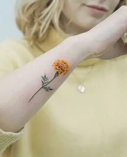 Yellow Marigold tattoo by tattooist picsola Birth flower tat