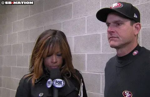 Jim Harbaugh & Pam Oliver are having a very serious postgame