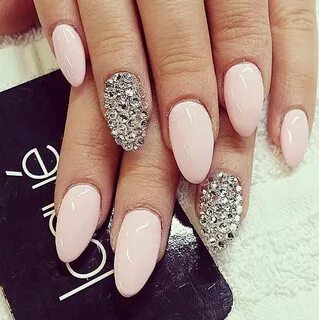 Pink acrylic almond nails with silver applications Find more