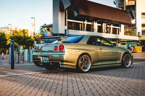 Фотография Ниссан GT-R gold R34 skyline авто