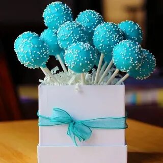 Cake Pops coated with blue candy melts and decorated with wh