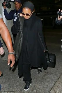 Janet Jackson wears head-to-toe black as she lands at LAX ai