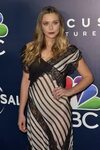 Elizabeth Olsen braless in a see-through monochrome dress at