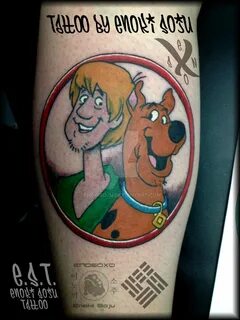 Scooby doo on a boob tattoo