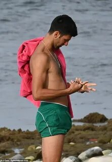 Tennis ace Novak Djokovic rolls up his shorts as he enjoys s