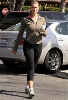 Pix Grove: Natasha Henstridge Walking with Coffee