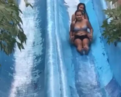 Girls Get Wiped Out On Water Slide