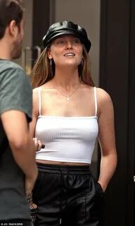 Little Mix's Perrie Edwards shows off nipple piercing as she