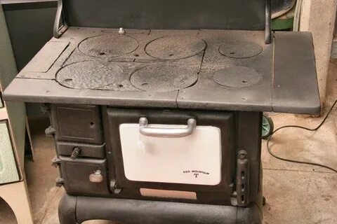 Old cast iron wood cook stove, "Red Mountain T, B - Dec 07, 