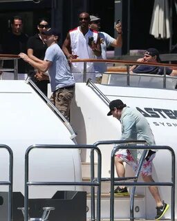 Leonardo DiCaprio and Jonah Hill step out onto a boat in Syd