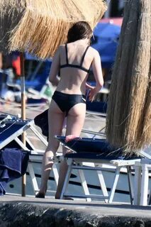 lily collins goes for a swim wearing a black bikini in ischi