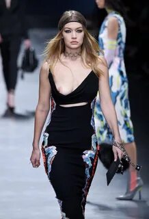 Gigi Hadid showing her bare boob on a runway at the Versace 