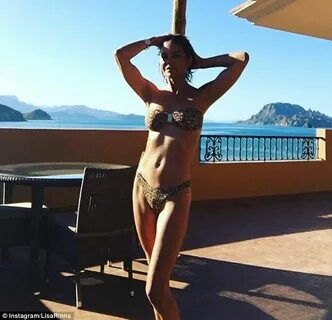 Lisa Rinna flaunts her rippling abs in animal print bikini d