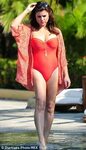 Tiffani Thiessen rocks a red bathing suit while on vacation 