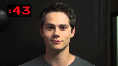 Dylan O'Brien staring at the camera, trying not to laugh - Y