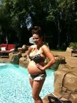 Photo Of Candice Michelle Looking Very Pregnant In A Bikini 