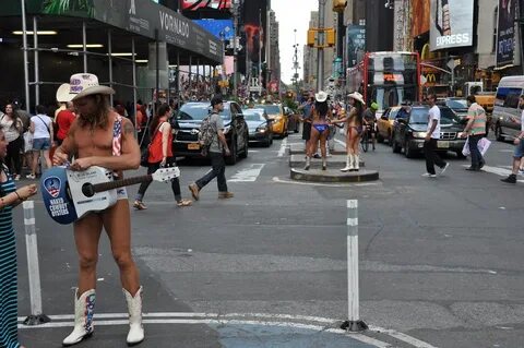 The original Naked Cowboy and his Naked Cowgirls (the Cowg. 