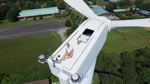 Drone Finds a Man Sunbathing atop a Wind Turbine Lost in Int
