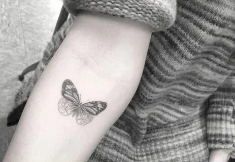 Fine line style butterfly tattoo on the right forearm. Littl
